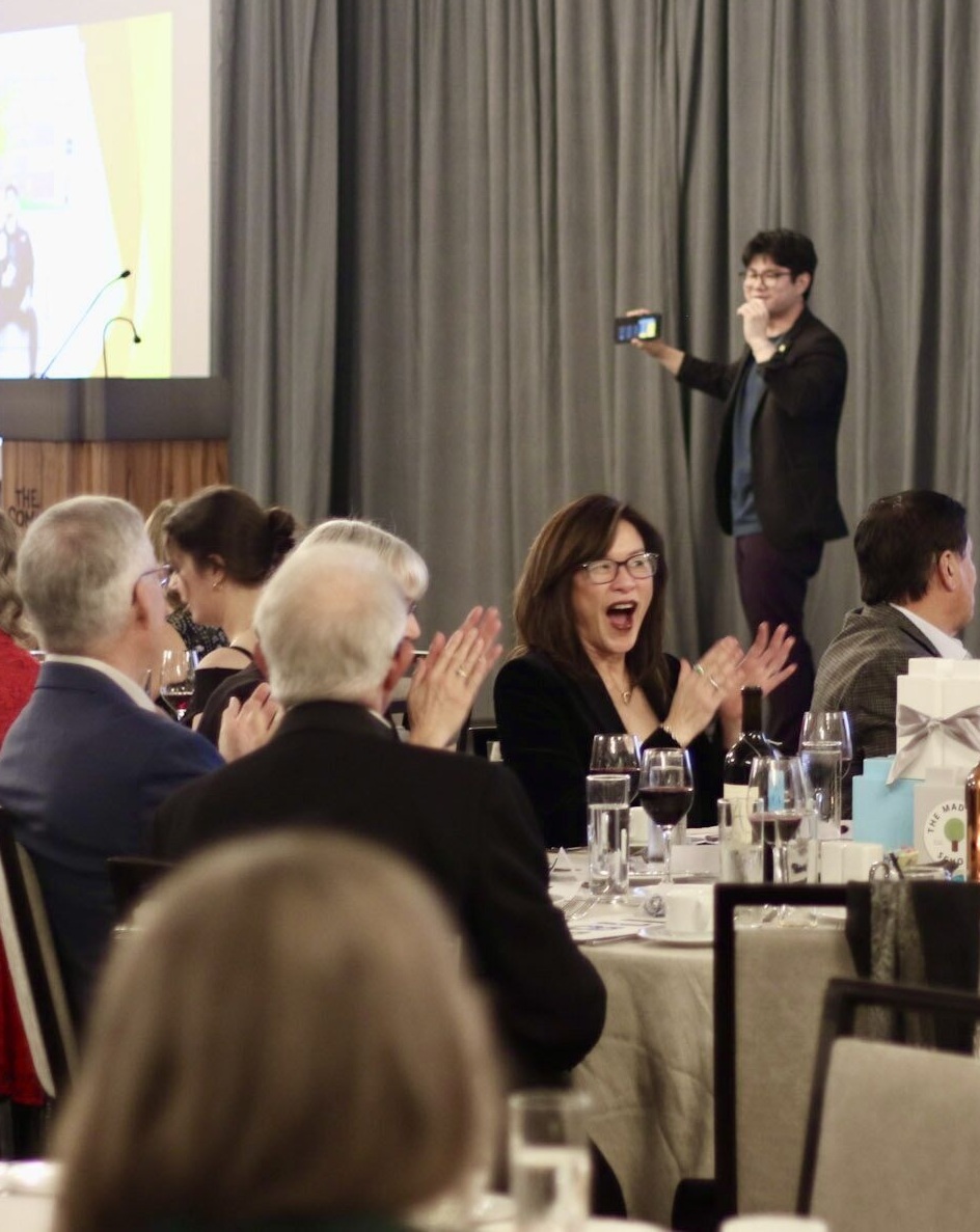 Woman reacts and is bewildered by Travis doing stage magic trick